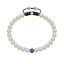 White fresh water pearl bracelet with pave set blue sapphire ball.