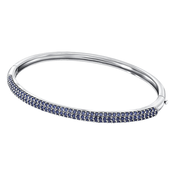 Sterling silver hinged bangle, pave set in Tanzanite colour crystals for December