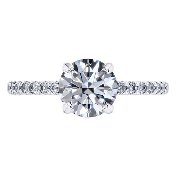 Elegant 4 Claw Platinum Round Brilliant Engagement Ring with Diamond Sides .